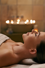 Image showing Woman, spa and candle with luxury, calm and peace with wellness and bokeh. Person, skincare and health for zen, relax and body care at resort or massage parlour and serene rest and treatment