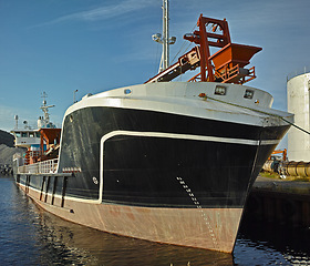 Image showing Boat, water and dock at sea to travel with closeup, windows or transportation for vacation sailing. Ship, harbor and ocean with yacht for tourism, holiday or adventure with morning blue sky or nature