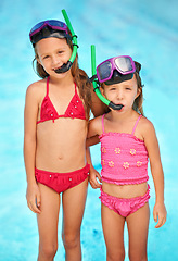 Image showing Snorkeling, goggles and portrait of kids at swimming pool, ready for adventure on vacation. Holiday, games or friends relax together with toys for fun, activity or children with safety gear for water