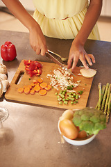 Image showing Hands, cooking and food with person in kitchen of home from above for health, diet and nutrition. Table, ingredients or recipe and chef chopping or cutting vegetables with knife closeup in apartment