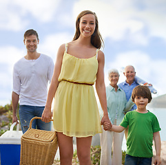 Image showing Portrait, picnic and happy family on beach for vacation, adventure and tropical holiday in Australia. Grandparents, parents and face of boy child at ocean with sunshine, weekend and smile in summer.