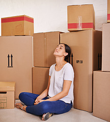 Image showing Woman, moving and boxes in living room for real estate, property investment and mortgage of new apartment. Homeowner, tired and female person with cardboard for home loan, relocation or renovation.