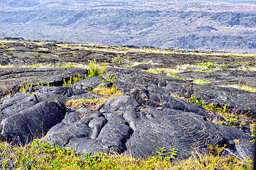 Image showing Nature, mountain rocks and landscape background with dry lava for destination, environment and outdoor adventure. Countryside, tourism and scenery for eco friendly, journey and explore in Hawaii.