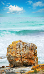 Image showing Water, beach and freedom for travel, vacation or summer holiday, seascape or adventure in nature. Ocean, rock or boulder in New Zealand for tropical paradise, peace or relax with stress relief at sea