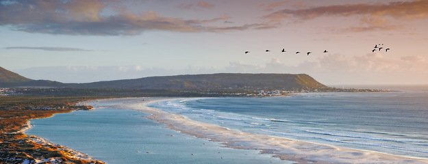 Image showing Water, drone and beach sunset with peace, beauty and location tranquility in nature. Aerial view, freedom and ocean sunrise for summer, travel or vacation, holiday or stress relief in South Africa