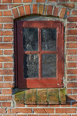 Image showing Old, window and exterior with brick wall of rustic wooden frame, abandoned house or building. Glass of historic outdoor home with vintage or rubble of damage, neglect or aged texture in dirt or dust