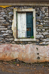 Image showing Old, window and dirty exterior with brick wall of abandoned house, building or concrete frame with broken doors. Historic outdoor decor of architecture, texture or rubble from damage, decay or wreck