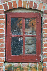 Image showing Old, window and exterior with brick wall of abandoned house, building or wooden frame. Glass of historic outdoor home with vintage or rustic rubble of damage, neglect or aged texture in dirt or dust