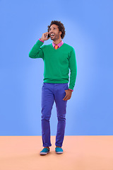 Image showing Fashion, black man and phone call in studio for color block in trendy clothes, style and outfit. Male person, stylist and fashionable for season trends with funky, edgy and formal wear in happiness