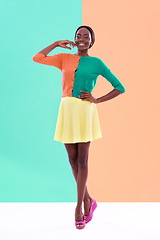 Image showing Black woman, fashion and portrait, studio and smile or happiness with color block background. Stylish, trendy and vibrant clothing for female model person, unique and casual retro for hipster lady