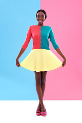 Image showing Fashion, studio or portrait of black woman with colorful, trendy and stylish outfit with smile. Unique, different and happy African model with edgy, classy and retro style on pink and blue background