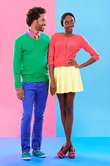Image showing Fashion, happy and young black couple in studio with colorful, trendy and stylish outfit. Smile, love and full body of confident African man and woman with edgy, classy and retro style by background.