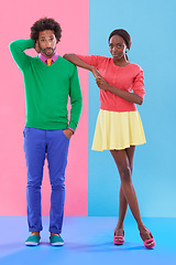 Image showing Confused, couple and portrait with fashion in studio, background and creative aesthetic. Doubt, question and woman with support of man and together with colorful retro style and unique clothes mockup
