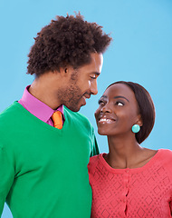 Image showing Hug, love and black couple with marriage, romance and bonding together on a blue studio background. Relationship, embrace and man with woman and peace with support and happiness with a date and care