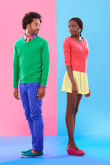 Image showing Fashion, love and young black couple in studio with colorful, trendy and stylish outfit for confidence. Bonding, full body and African man and woman with edgy, classy and retro style by background.
