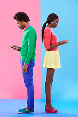 Image showing Couple, texting and phone in colorful clothes for fashion, dating or new love with crush. African people, young and serious for message on cell for flirting, conversation and chatting together