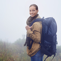 Image showing Happy woman, hiking and portrait in nature with backpack and morning fitness for adventure in mountain. Young person, positive and face in outdoor exercise and walk on journey in sweden countryside