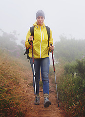 Image showing Woman, hiking and trail in nature with fitness outdoor gear for travel, adventure and backpacking. Freedom, path and female person in trekking pole for wellness, exercise or balance in forest.
