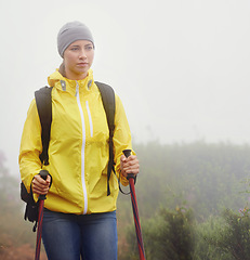 Image showing Woman, trekking and fitness in nature with pole for backpacking, travel and outdoor adventure. Journey, path and female person in hiking gear for exercise, balance or health in forest trail.
