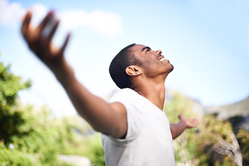 Image showing Face, smile and freedom with black man in garden of home on blue sky for summer freedom or fresh air. Thinking, motivation and inspiration with happy young person hands raised outdoor in backyard