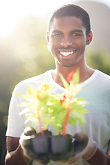 Image showing Portrait, happy and planting flowers with black man in garden of home for summer landscaping. Face, nature and smile with young person gardening outdoor in backyard for growth or green cultivation