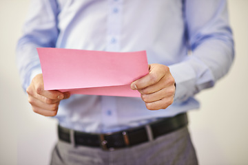 Image showing Businessman, shirt and letter for termination in company for warning, document and information. Executive, manager or worker with closeup of paper in hand for job, profit loss and turnover