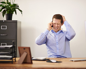 Image showing Stress, phone call and businessman at desk with anger, bankruptcy and notification of unemployment. Anxiety, depression and burnout with smartphone, frustrated man in office and termination notice.