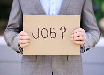 Image showing Jobless, cardboard and person with suit, outdoor and adult with unemployment with poverty. Employee, search and hunting for work with sign on street in city of Cape Town for career opportunity