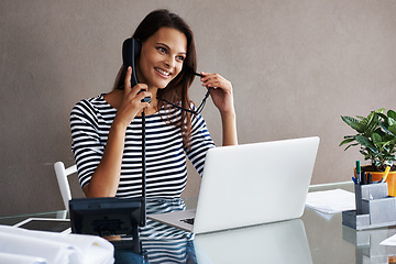 Image showing Woman, smile and laptop with telephone for phone call, discussion and conversation with client. Receptionist, landline and table with technology at workplace for consulting, admin or customer service