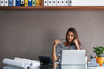 Image showing Woman, telephone and laptop at desk with call for discussion, conversation and talking to client. Receptionist, landline and table with paper at workplace for planning, admin or customer service