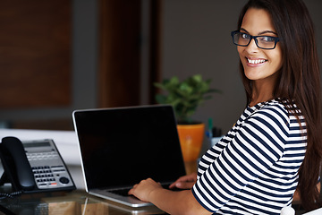 Image showing Portrait, laptop screen and home office with designer woman in workplace for small business or startup. Desk, computer and smile with happy young employee in apartment for creative job or work