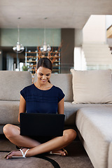 Image showing Businesswoman, laptop and work from home, floor and sofa in lounge. Smile, research and living room for journalist or blogger, entrepreneur or happy female person with technology media for startup