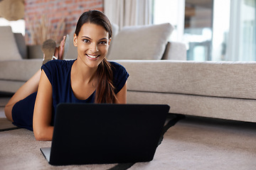 Image showing Laptop, happy and portrait of woman relaxing on carpet working on freelance project at home. Smile, technology and female person with computer for creative research laying on floor mat in living room