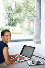 Image showing Happy, computer and portrait of woman relaxing on carpet working on freelance project at home. Smile, technology and female person with laptop for creative research laying on floor mat in living room