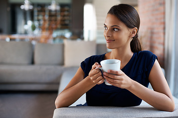 Image showing Woman, thinking and drinking coffee in home on sofa to relax, peace or planning at breakfast in the morning. Dream, tea cup or person with idea for espresso, latte or healthy beverage in living room
