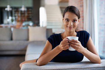 Image showing Happy woman, portrait and drinking coffee in home on sofa to relax, peace or calm at breakfast in the morning. Face, tea cup and person in living room with espresso, latte and hot healthy beverage