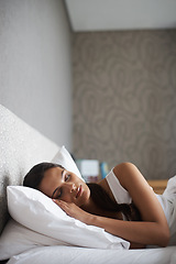 Image showing Woman, sleeping and bed for rest, dream and wellness as stress relief in bedroom in Rio de Janeiro. Mental health, female person and eyes closed on pillow for calm, peace and relax for self care