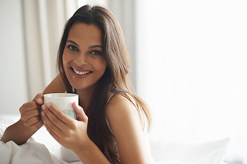 Image showing Smile, portrait and woman with coffee in bedroom with caffeine to wake up in morning at home. Happy, relax and comfy young female person drinking mug of cappuccino, espresso or latte in apartment.