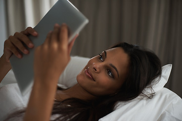Image showing Bedroom, night and woman online with tablet, social media and technology for connection to app. Bed, smile and communication with mobile, digital and female person on dating site with internet