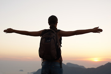 Image showing Woman, silhouette and freedom with mountain, sunset and adventure for travel or holiday. Tourist, brazil and backpack with sunrise, view and nature for calm and fulfillment with hike for health