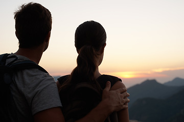 Image showing Travel, sunset and couple in mountains with view of sky together on holiday or vacation abroad. Love, hiking or backpacking with man and woman outdoor for tourism or discovery overseas from back