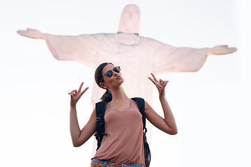 Image showing Jesus, woman or tourist on holiday with statue for travel or christian faith with art or peace sign. Person, vacation or history monument for tourism, God or religion symbol in Rio de Janeiro, Brazil