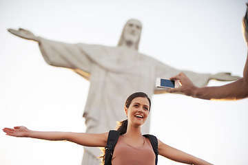 Image showing Woman, photo and jesus statue for travel, backpacking and happy on journey on summer vacation. Art deco sculpture, peace or christ the redeemer in photography of lady or tourism destination in brazil