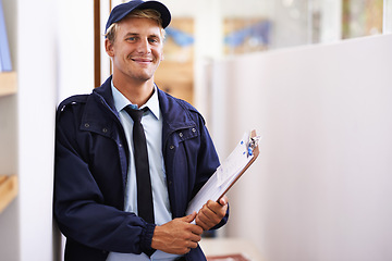 Image showing Portrait, smile and delivery with courier man at office for distribution, shipping or service. Ecommerce, logistics or retail and happy young postal worker with clipboard for manifest or order