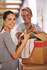 Image showing House, couple and smile with box for moving in with clothes, satisfied and property ownership. Family, people and packing furniture in new home with investment, real estate for growth and future.