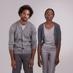 Image showing Bored, tired and portrait of couple in studio with bad posture for anxiety, depression or lazy. Man, woman and face of moody people for burnout with grief, mental health or sad on gray background