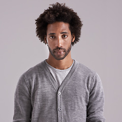 Image showing Afro, studio and portrait of man with fashion for trendy, clothes and cool style on gray background. Jersey, black person and serious face with confidence for style, fashionable and relaxing