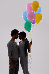 Image showing Couple, silhouette and love with party balloons for celebration, event or romance on a gray studio background. Man and woman with colorful blowups of helium for date or anniversary on mockup space