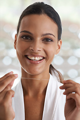 Image showing Woman, teeth and smile with floss, self care and portrait for health in bathroom. Person, cleaning and healthcare for dental, oral hygiene and routine at home or house with dentistry and whitening