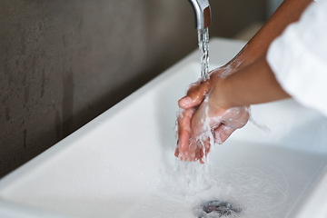 Image showing Hands, water and cleaning for hygiene and skincare, splash in basin with soap and person in bathroom for handwashing. Health, bacteria and germs removal with self care, cosmetics and treatment